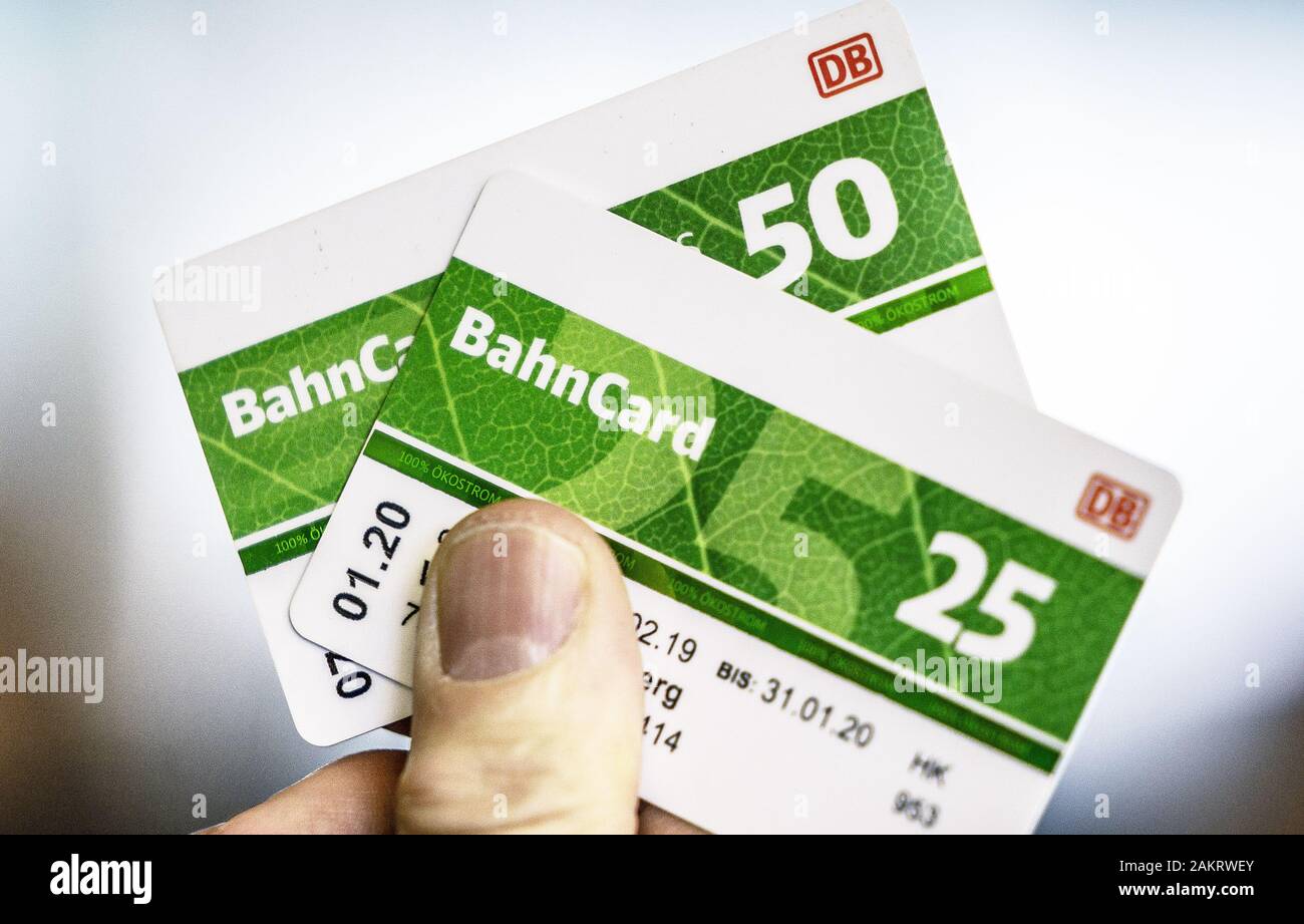 Berlin, Germany. 10th Jan, 2020. A man holds one Bahncard 25 and one  Bahncard 50, and the Bahncards 50 and 25 will be ten percent cheaper in the  future. According to dpa