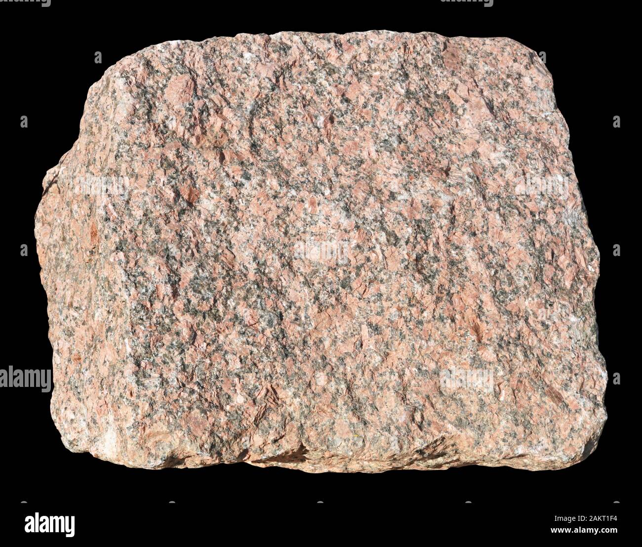 The big ancient square shape  red granite stone. Isolated on black  with patch Stock Photo
