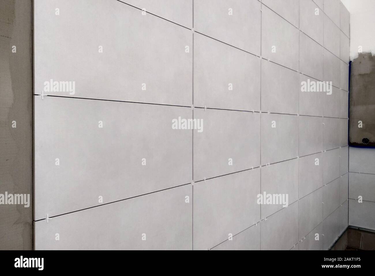 Wall ceramic tiles installation on mortar glue Stock Photo Alamy