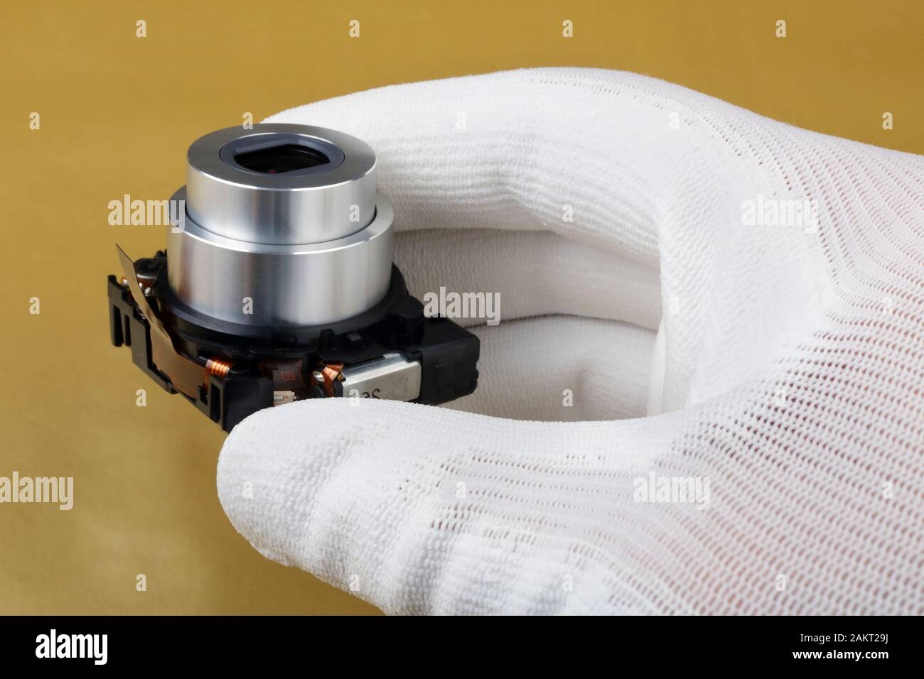 Lens Machine Controls IT engineer technician controls the modern lens assy for avideo camera ...