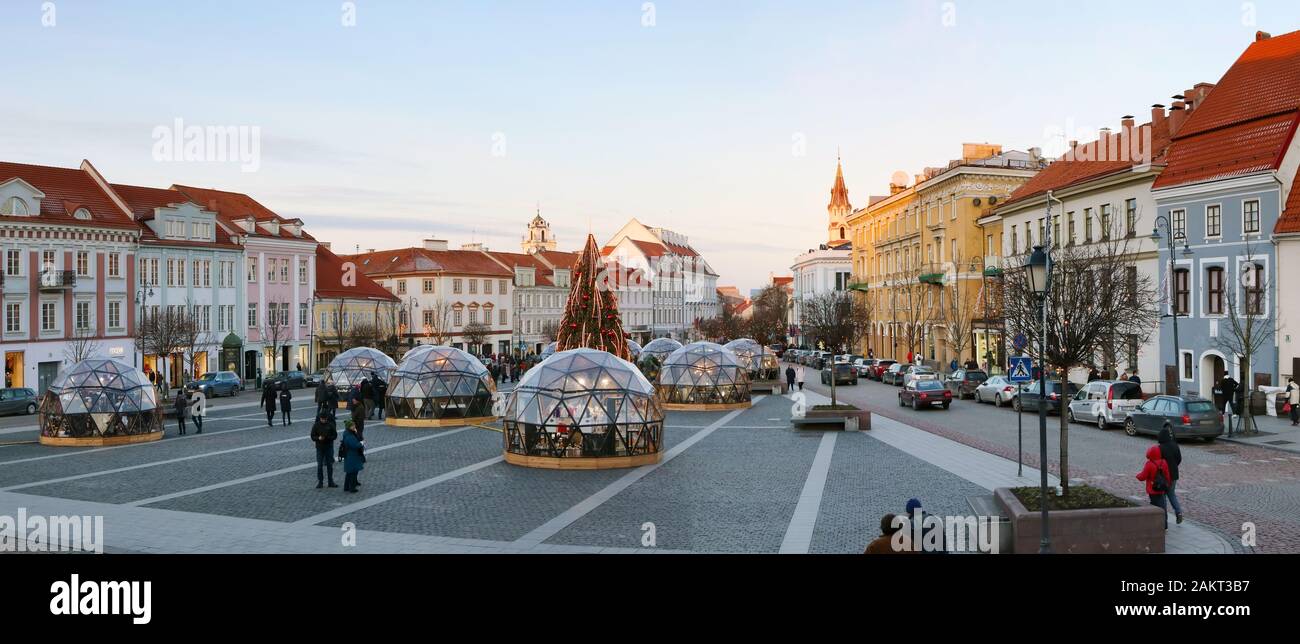 VILNIUS, LITHUANIA - DECEMBER 29, 2019: Christmas European city square of the main town hall decorated illuminate fir tree in space comet  style. In G Stock Photo