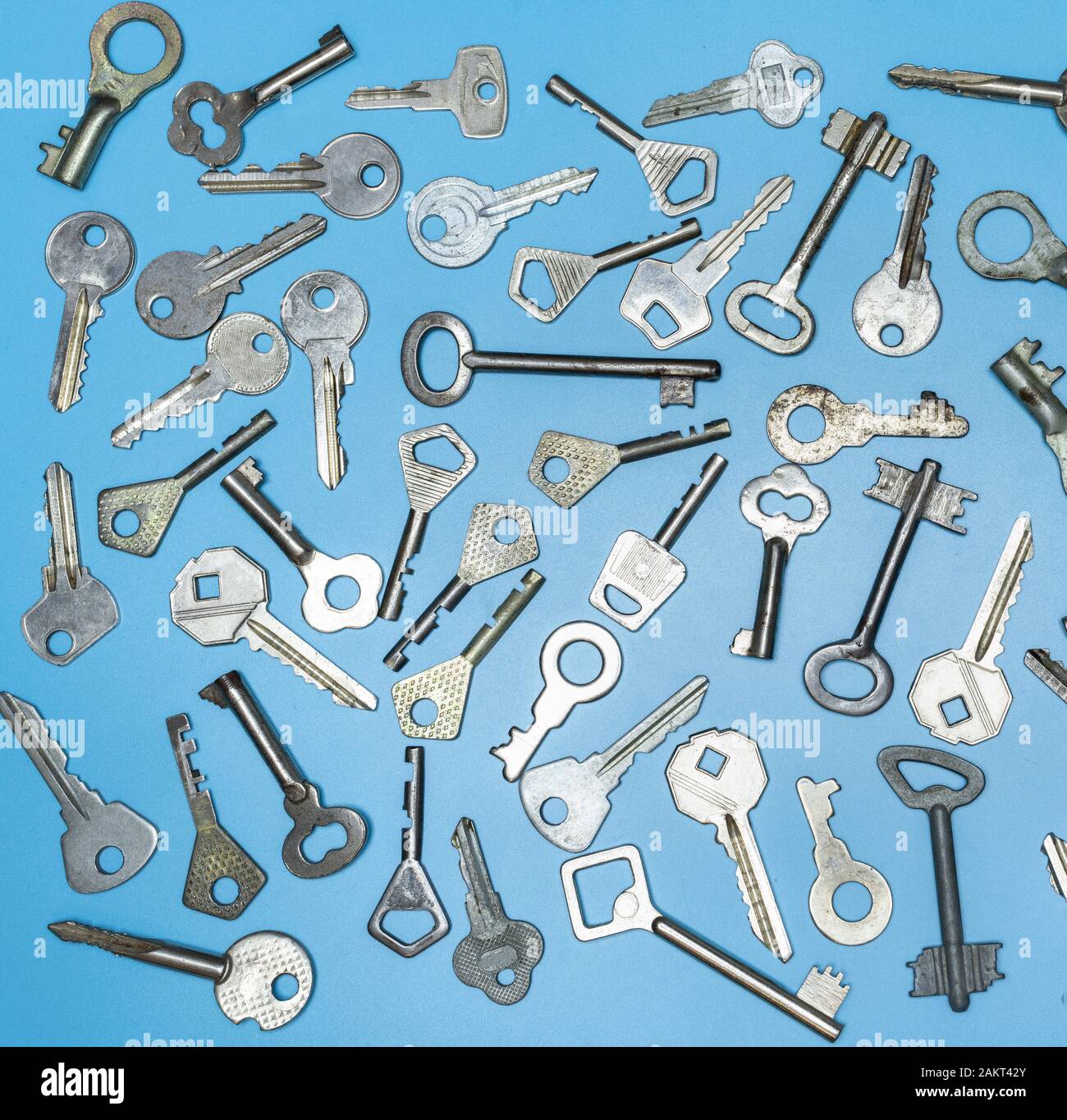 Keys set on blue background. Door lock keys and safes for property ...