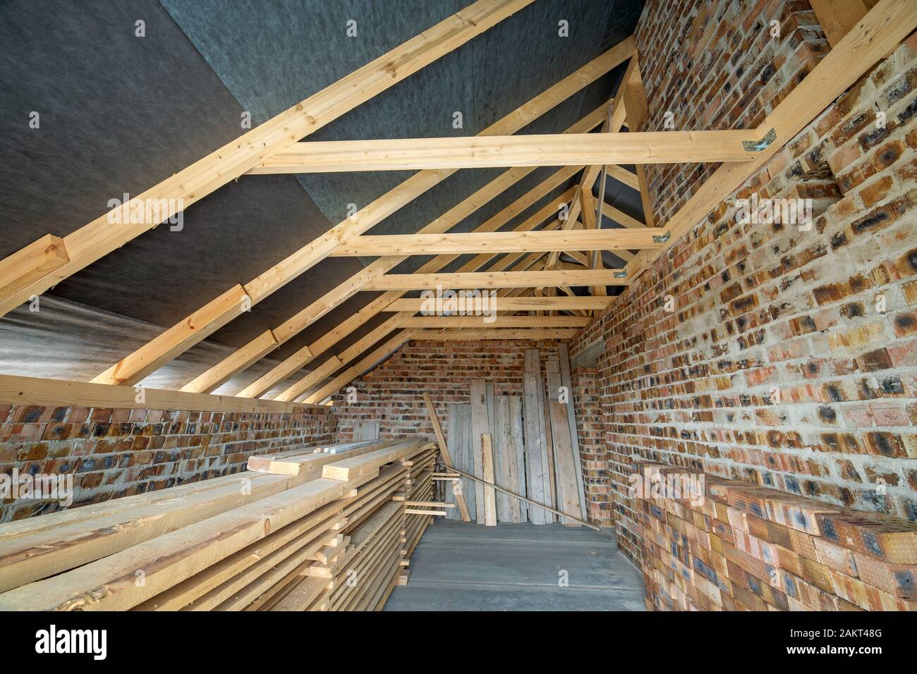 Interior Of Unfinished Brick House With Concrete Floor Bare Walls