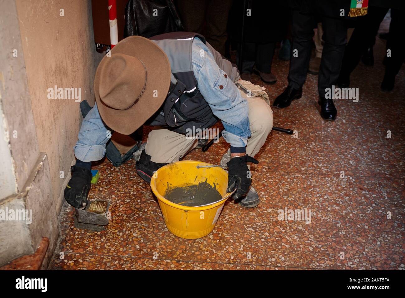 Bologna, Italy. 10th January, 2020. The German artist Gunter Demnig placing some stolpersteinen stumbling blocks in a few points of the city to remember the Jewish victims of the Nazism Holocaust on January 10, 2020 in Bologna, Italy. Credit: Massimiliano Donati/Alamy Live News Stock Photo
