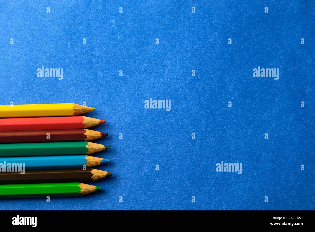 Multi colored crayons at blue background with copy space Stock Photo ...