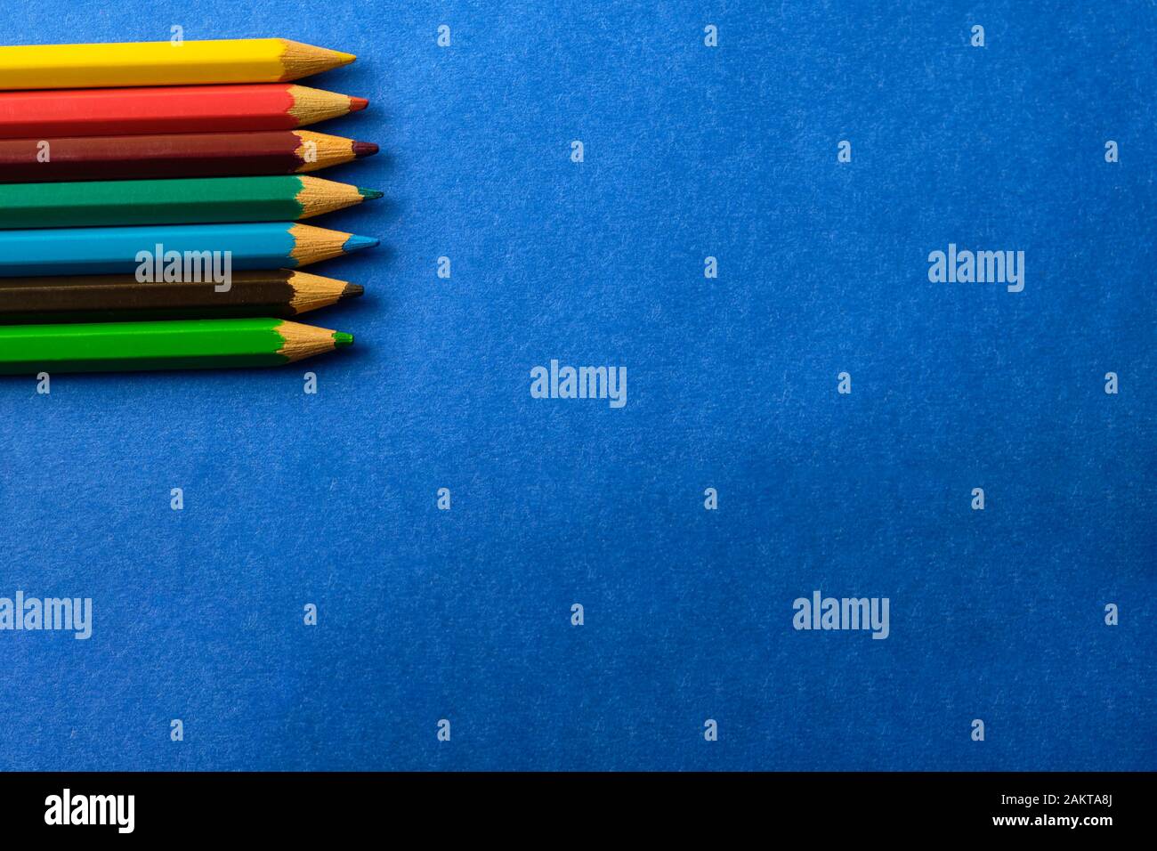 Multi colored crayons at blue background with copy space Stock Photo ...