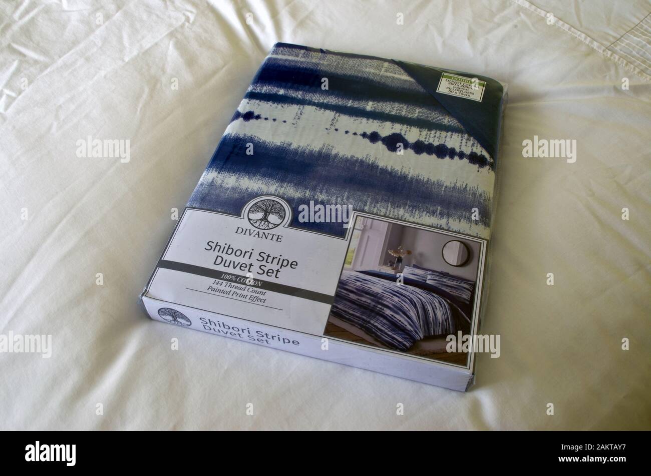 Divante Shibori Stripe 100% Cotton Duvet Bedding Set On A Bed Stock Photo