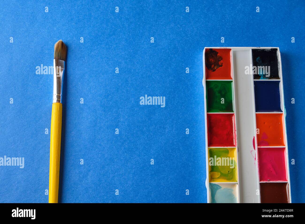 brush and water color paint at blue background with copy space Stock ...