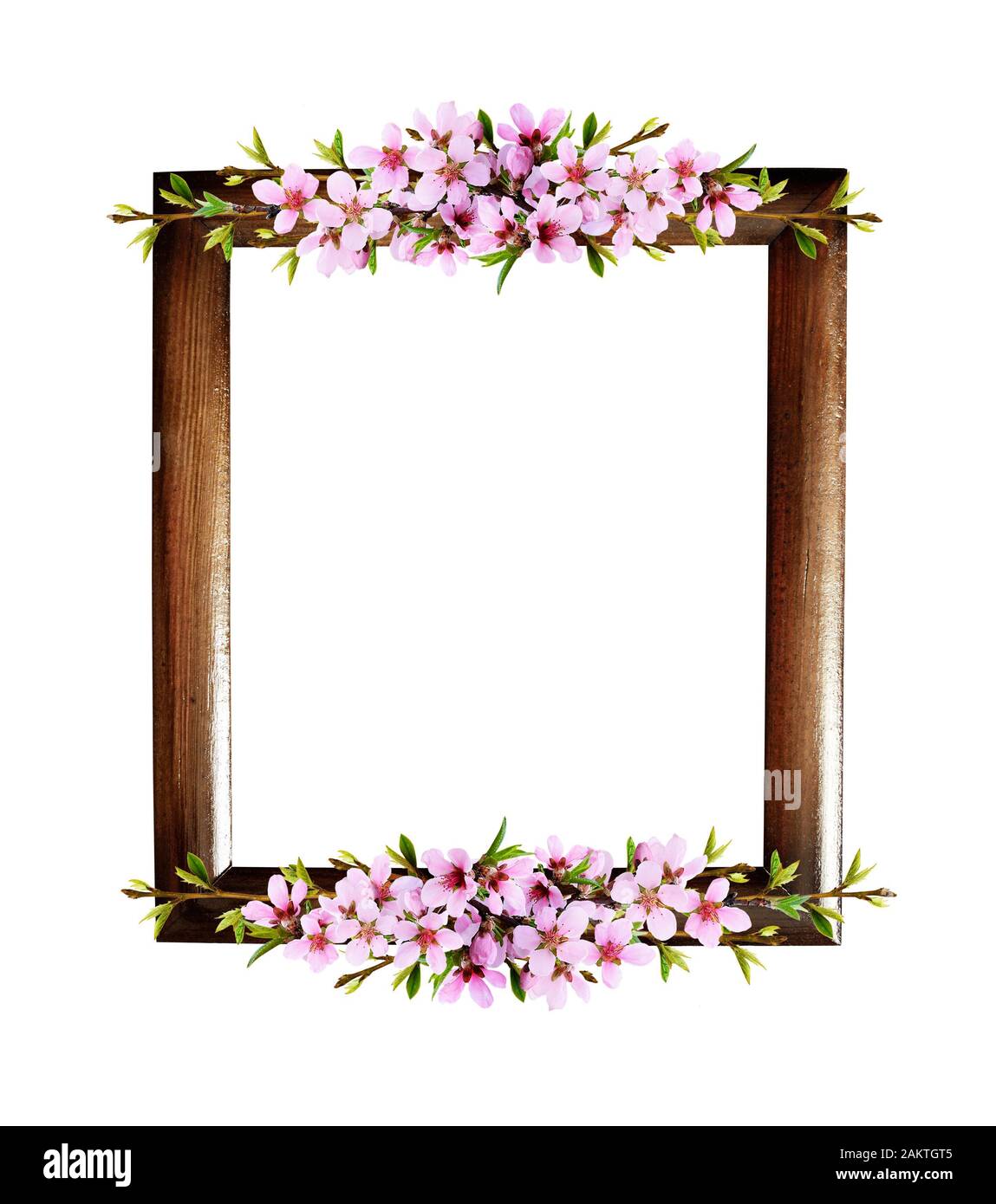 Spring twigs of peach flowers in a line arrangements with wooden frame ...