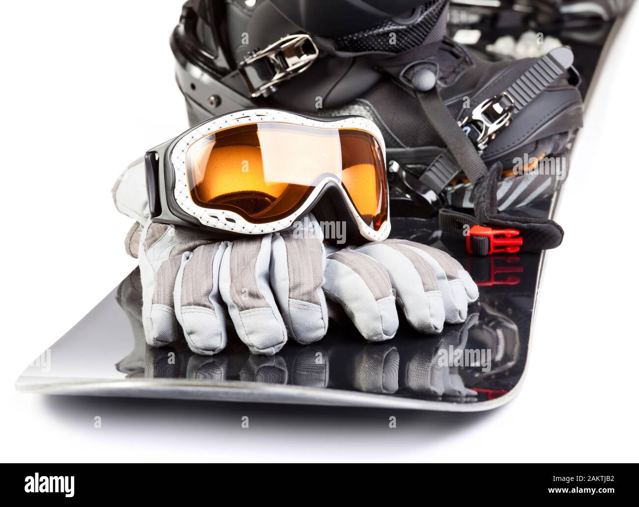 Snowboard with boot helmet gloves and goggles on white background Stock