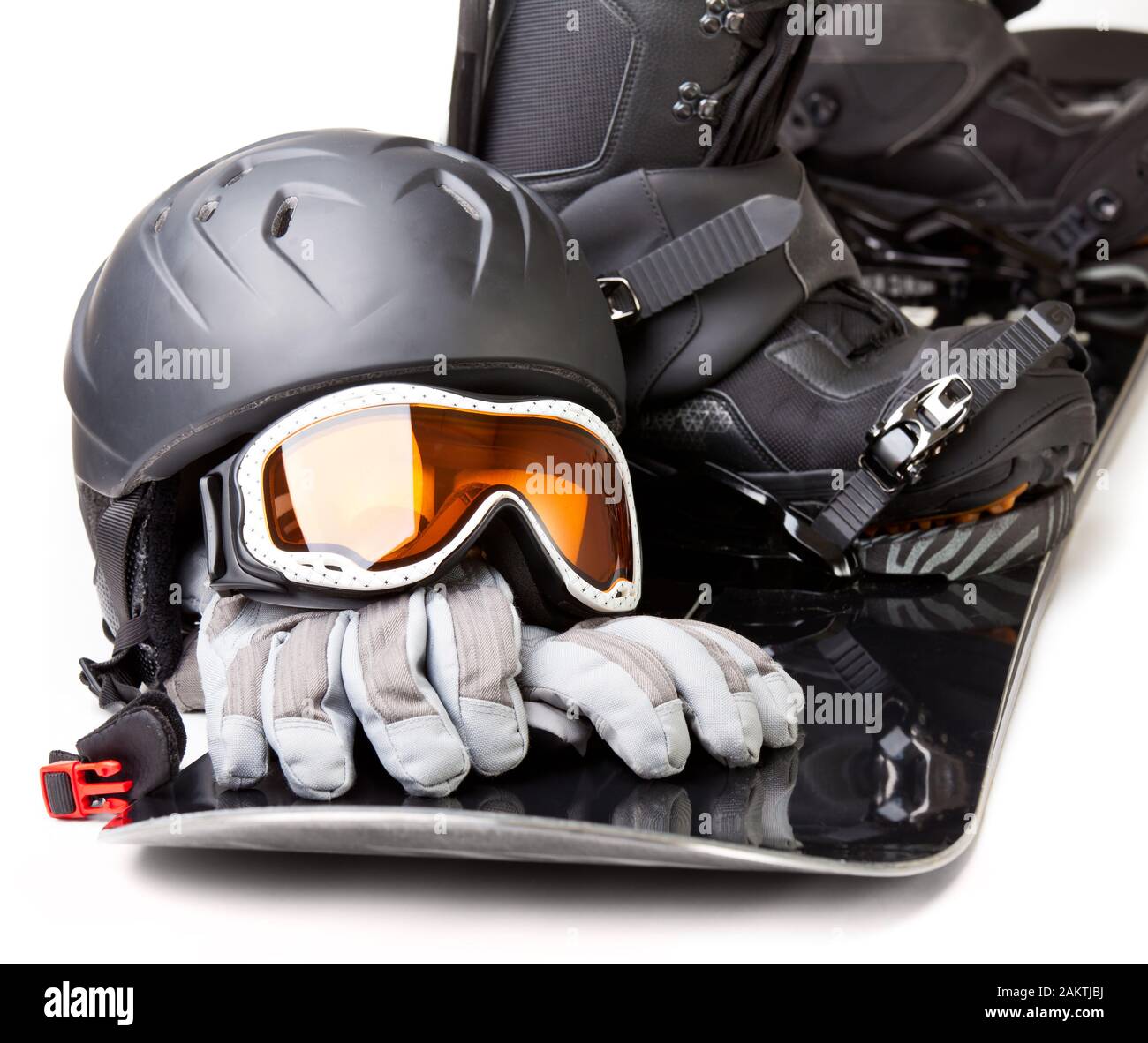 Snowboard with boot helmet gloves and goggles on white background Stock