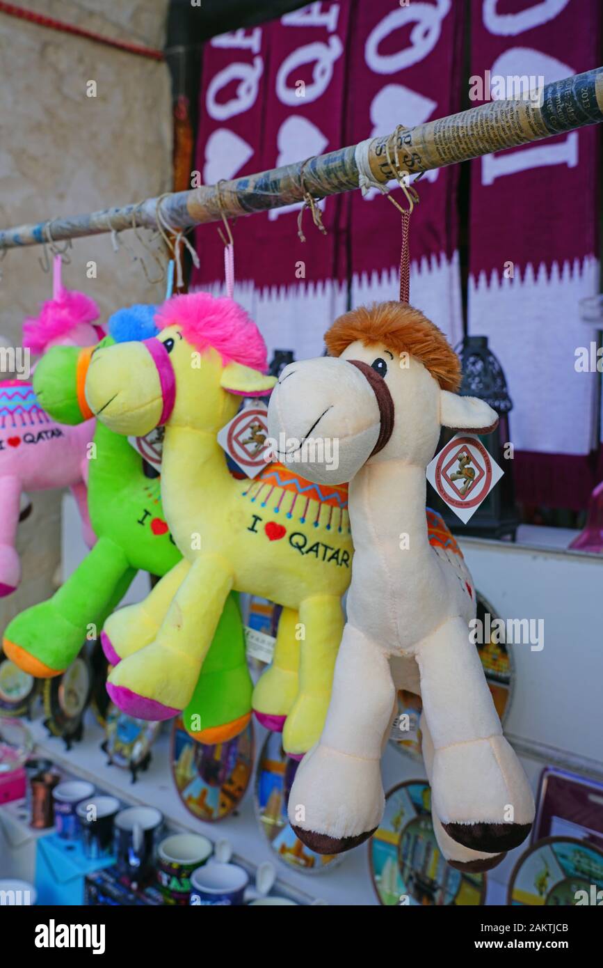 DOHA, QATAR -12 DEC 2019- Plush camel toys for sale as souvenirs in the market at the Souq Waqif in the center of Doha,  the capital of Qatar. Stock Photo