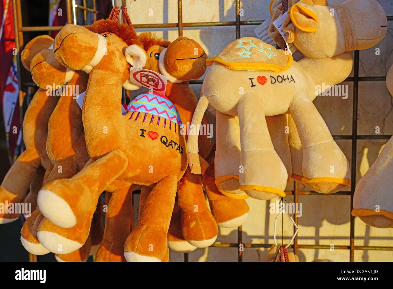 DOHA, QATAR -12 DEC 2019- Plush camel toys for sale as souvenirs in the market at the Souq Waqif in the center of Doha,  the capital of Qatar. Stock Photo