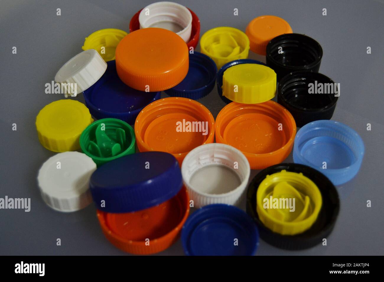 Plastic bottle stoppers of various colors and sizes for recycling Stock