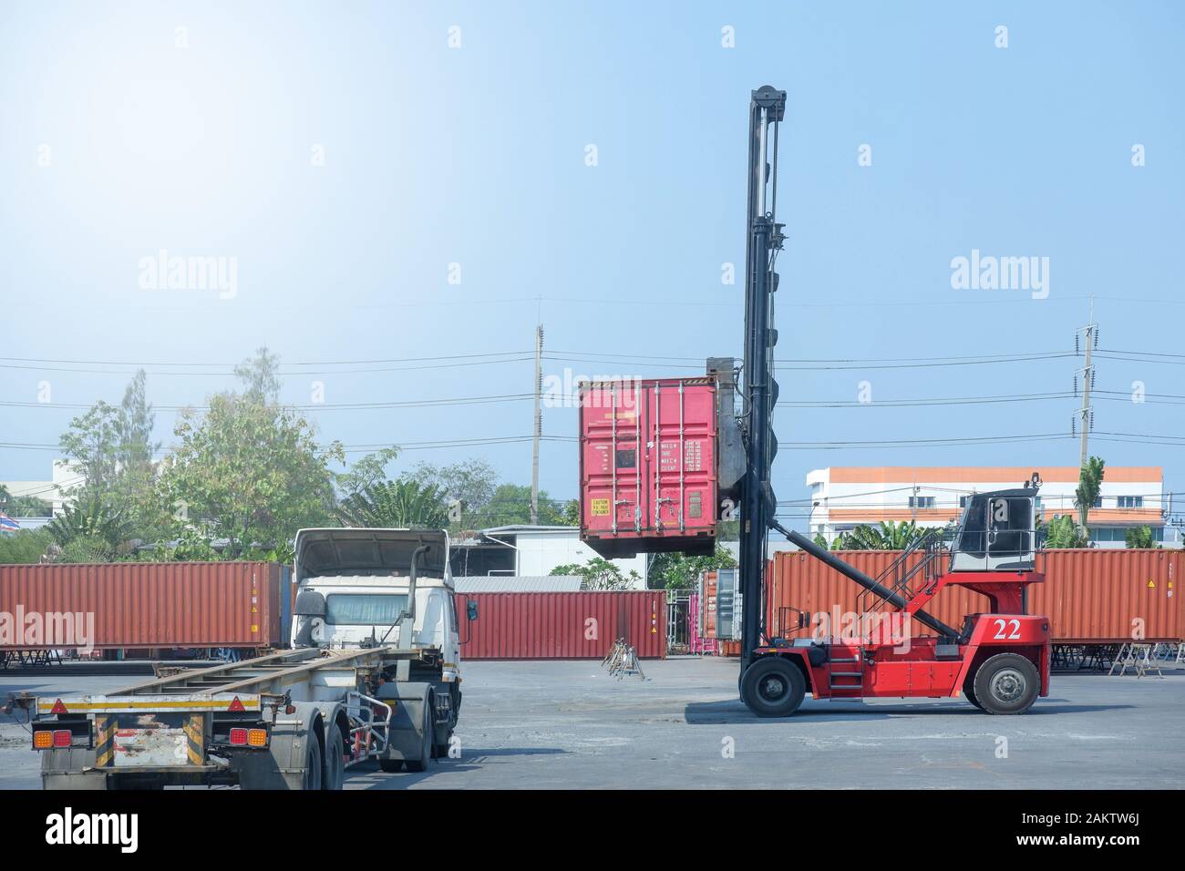 Container stacker, load the container into the truck. Transportation ...