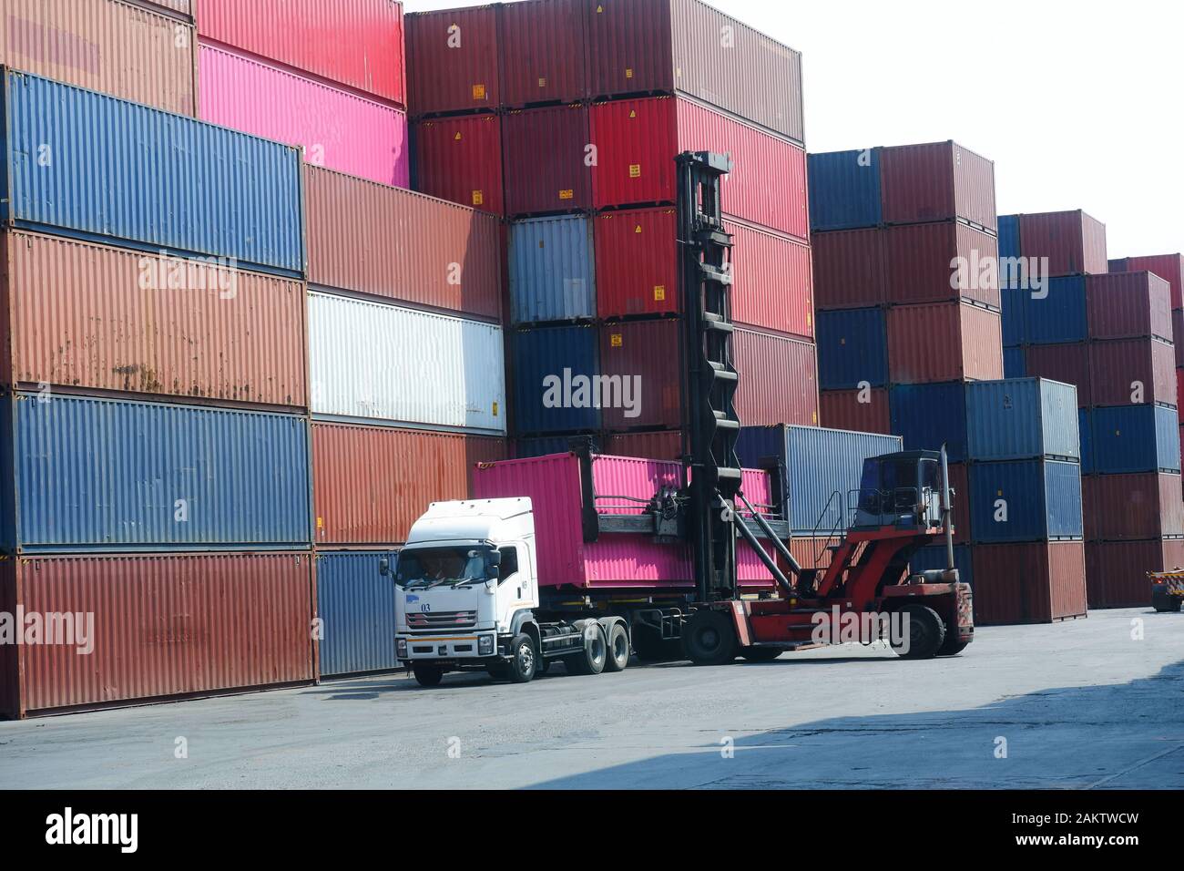 Container stacker, load the container into the truck. Transportation ...
