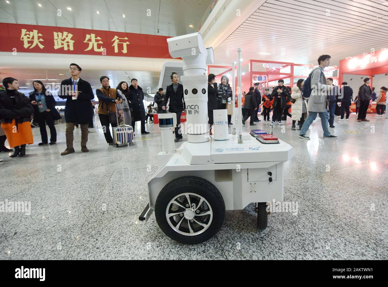 A police robot powered by the 5G wireless service of China Mobile patrols the East Hangzhou Railway Station during the annual Spring Festival travel r Stock Photo