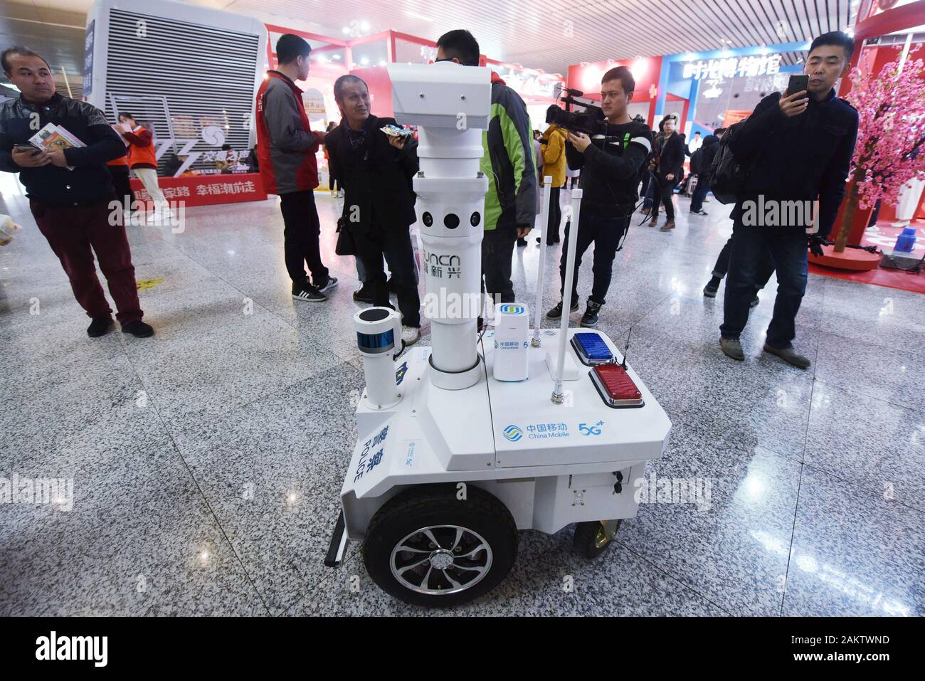 A police robot powered by the 5G wireless service of China Mobile patrols the East Hangzhou Railway Station during the annual Spring Festival travel r Stock Photo