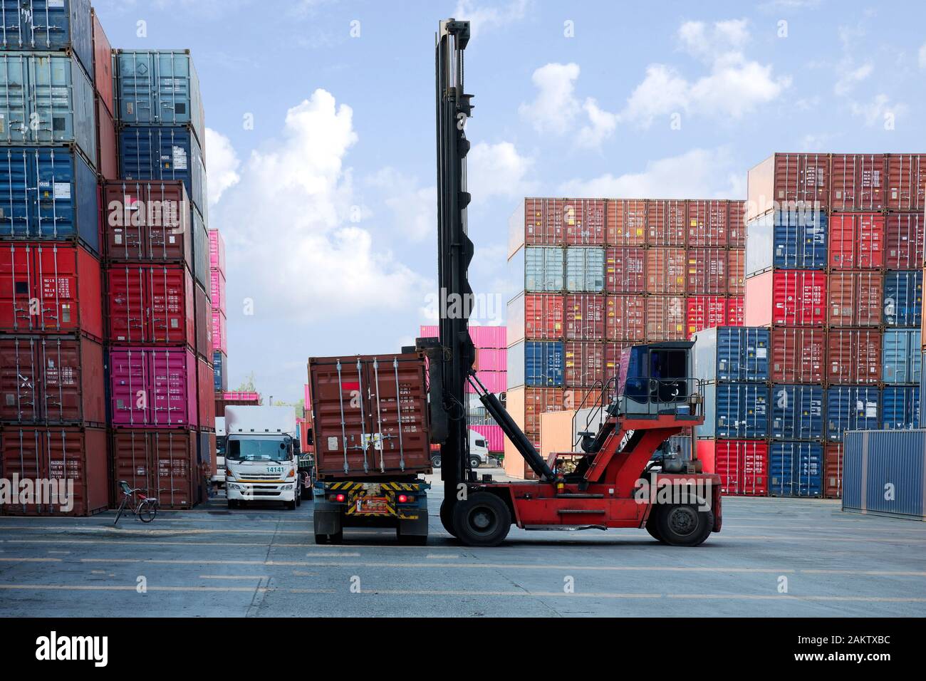 Container stacker, load the container into the truck. Transportation ...