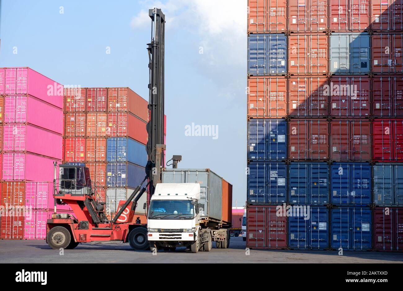 Container stacker, load the container into the truck. Transportation ...