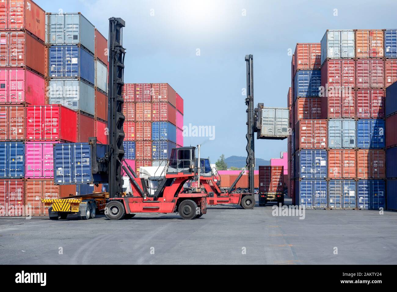Container stacker, load the container into the truck. Transportation ...