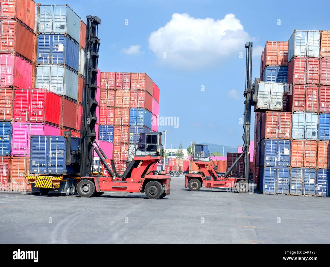Container stacker, load the container into the truck. Transportation ...