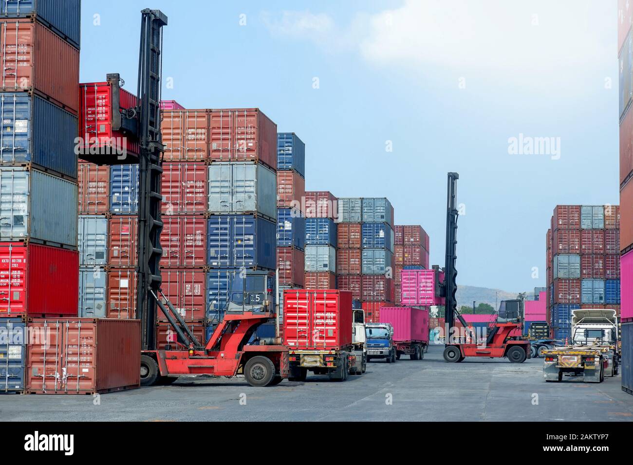 Container stacker, load the container into the truck. Transportation ...
