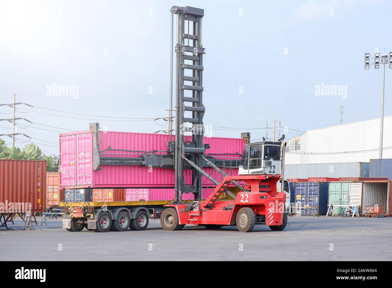 Container stacker, load the container into the truck. Transportation ...