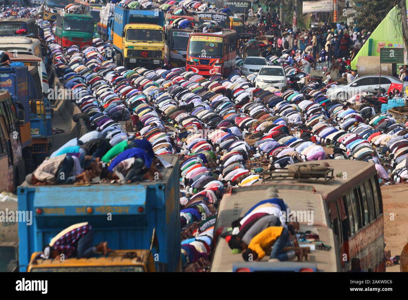 Muslim devotees offer prayers during the World Muslim Congregation, also known as 'Biswa Ijtema' at Tongi on the outskirts of Dhaka.Millions of Muslim devotees from around the world join the four-day long event that ends with a special prayer on the final day. Stock Photo