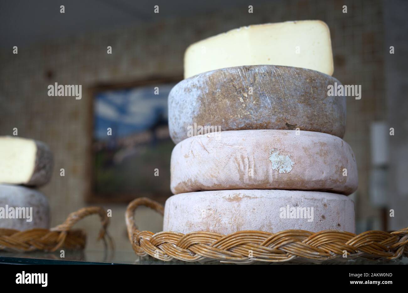 Delicious artisan Pyrenean cheese on sale at the indoor market of Nay, Pyrenees Atlantiques, Nouvelle Aquitaine, France Stock Photo