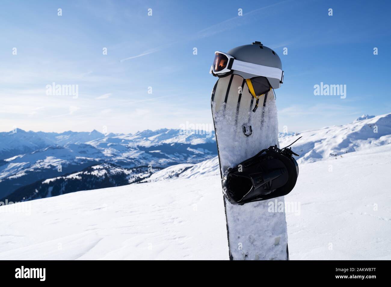 Winter Sports Equipment Against Snowcapped Rocky Mountains Stock Photo