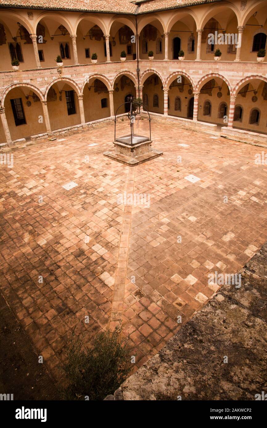 Courtyard of the 13th C friary (Sacro Convento) of Saint Francis of Assisi next to the lower basilica. Stock Photo