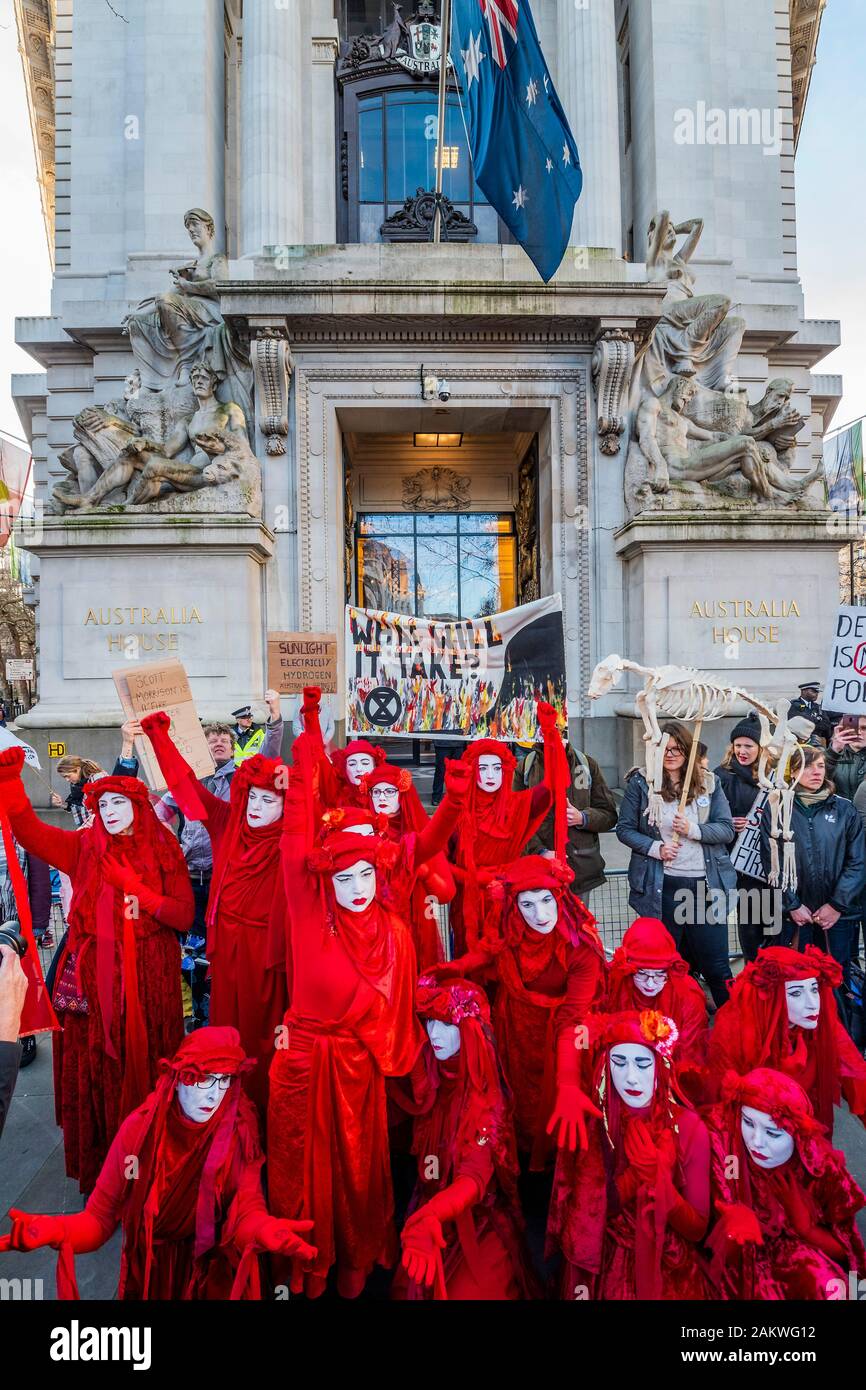 London, UK. 10th Jan 2020. The Red Rebels arrive silently, as usual, and temporarily block the entrance - Extinction rebellion gather outside the Australian High Commission, on the Aldwych, to protest about the attitude of the Australian Government to climate change, in general ,and the forest fires (and their wider impact), in particular. Credit: Guy Bell/Alamy Live News Stock Photo