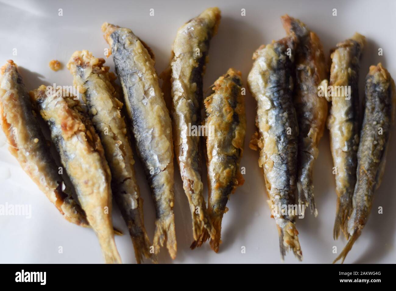 Sardine. Fried fish in a white plate. Spanish tapa. Appetizer Stock Photo Alamy