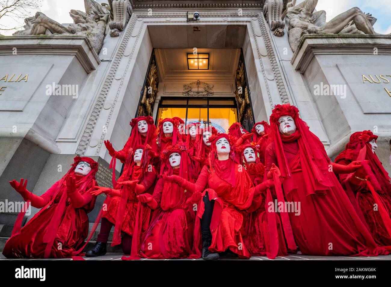London, UK. 10th Jan 2020. The Red Rebels arrive silently, as usual, and temporarily block the entrance - Extinction rebellion gather outside the Australian High Commission, on the Aldwych, to protest about the attitude of the Australian Government to climate change, in general ,and the forest fires (and their wider impact), in particular. Credit: Guy Bell/Alamy Live News Stock Photo