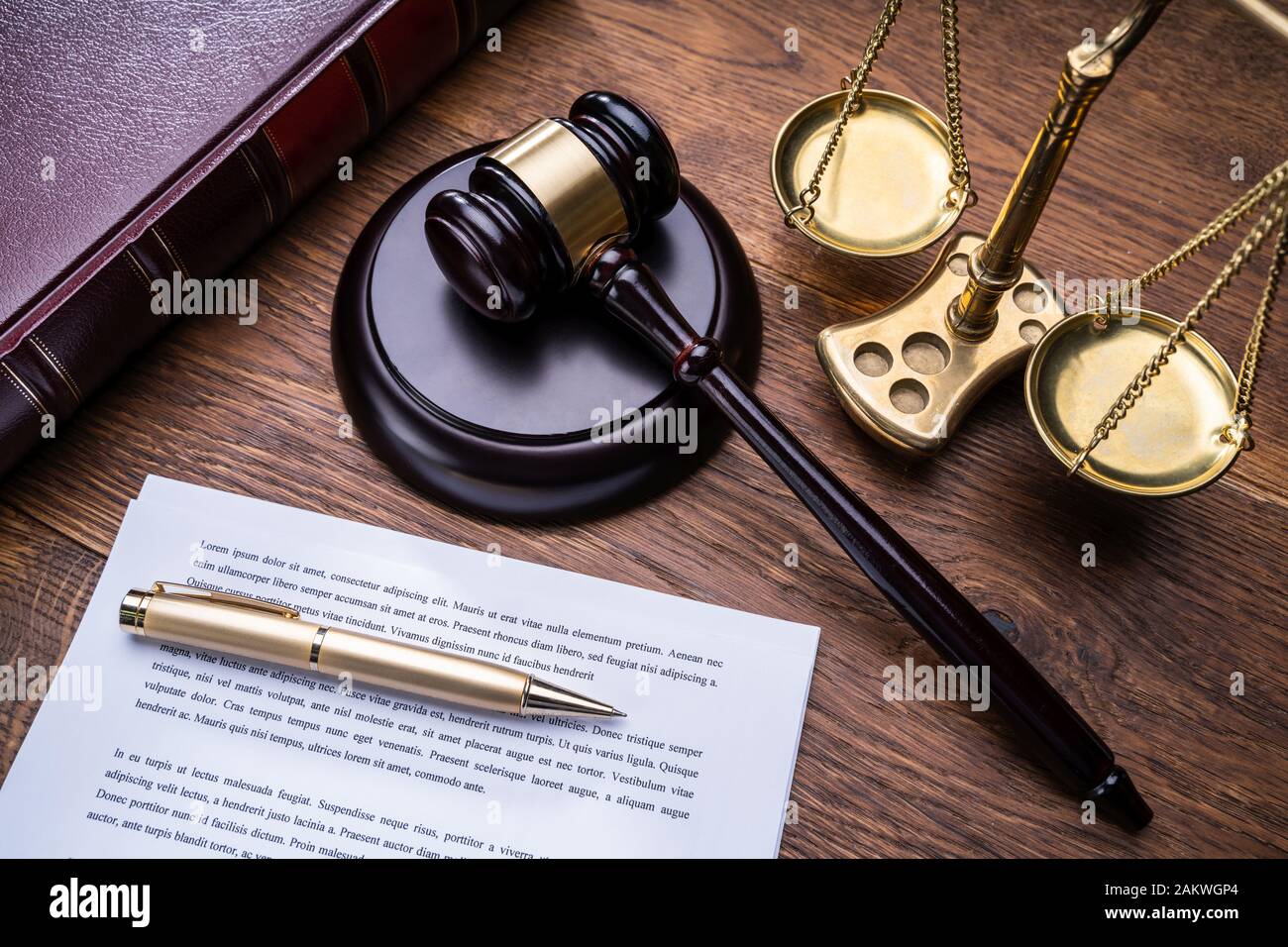 Wooden Gavel Golden Scale And Law Book On Table Stock Photo - Alamy