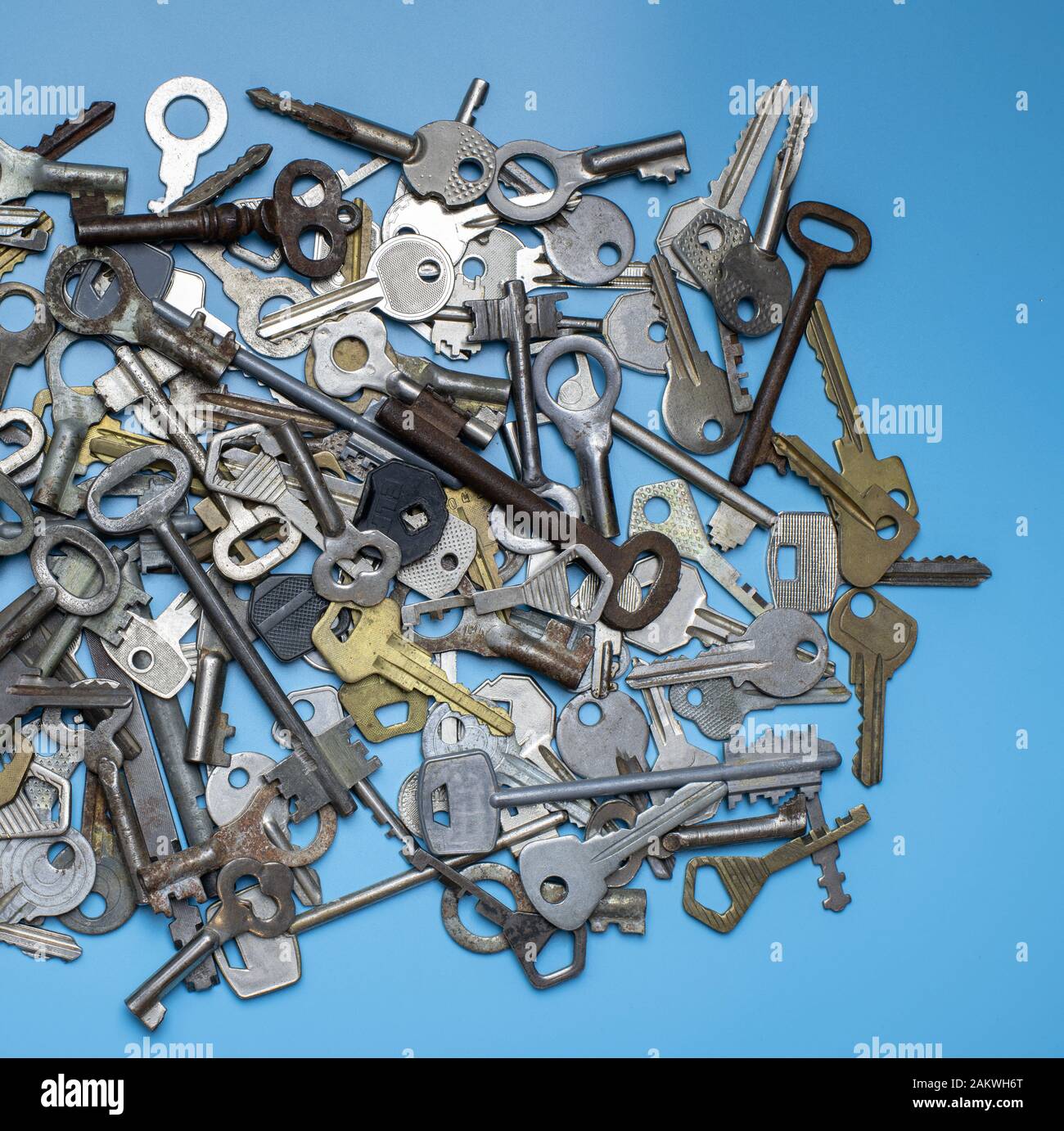 Keys set on blue background. Door lock keys and safes for property ...