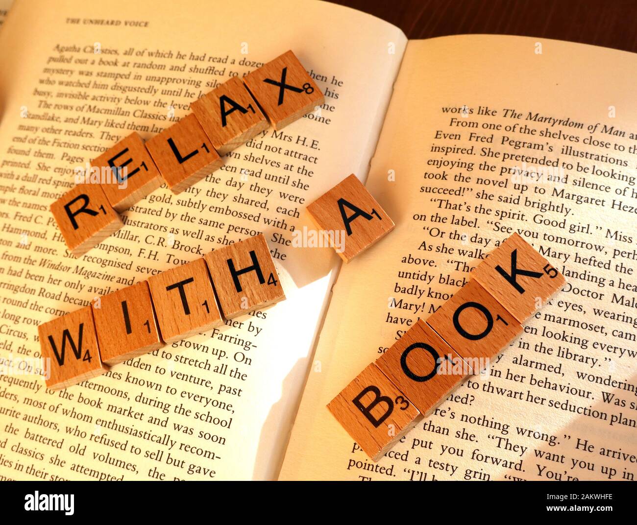 Relax with a book, promotion of reading and physical books Stock Photo