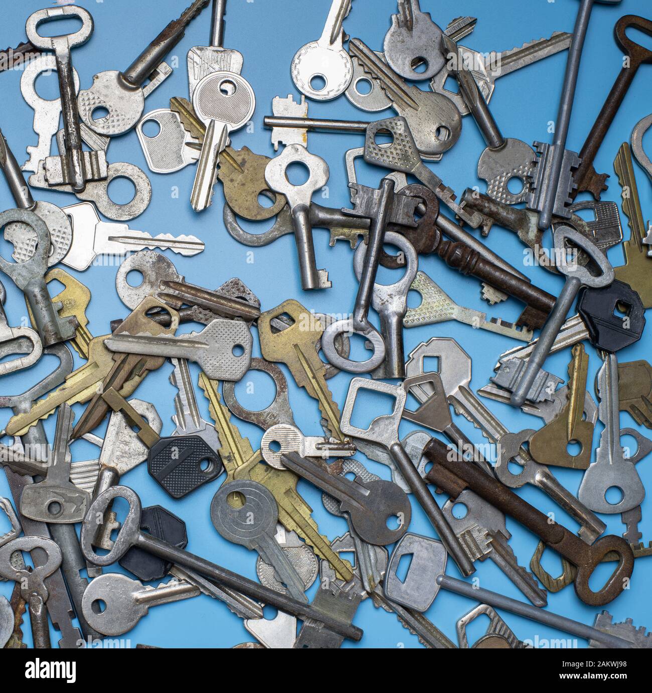 Keys set on blue background. Door lock keys and safes for property ...