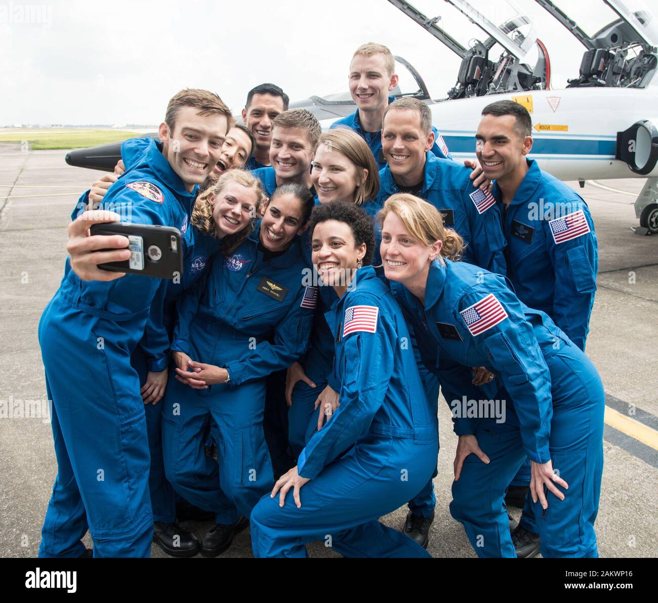 NASA's 2017 Astronaut Candidate Class stopped for a group photo while getting fitted for flight suits at Ellington Airport near NASA's Johnson Space Center in Houston, Texas on June 6, 2017. NASA is honoring the first class of astronaut candidates to graduate under the Artemis program on January 10, 2019, at the agency's Johnson Space Center in Houston. After completing more than two years of basic training, these candidates will become eligible for spaceflight, including assignments to the International Space Station, Artemis missions to the Moon, and, ultimately, missions to Mars. Stock Photo
