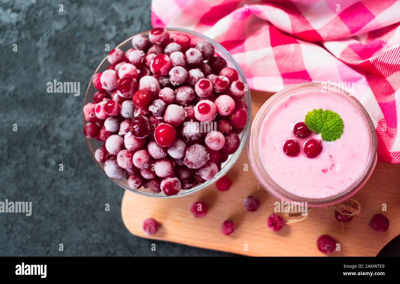 Frozen cranberry yogurt on a black background. The concept of healthy
