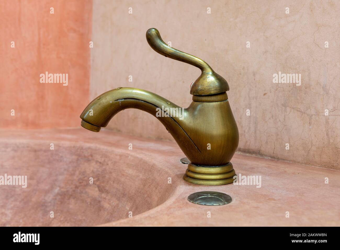 A rustic bathroom sink and tap in Trinidad, Cuba, Caribbean Stock Photo