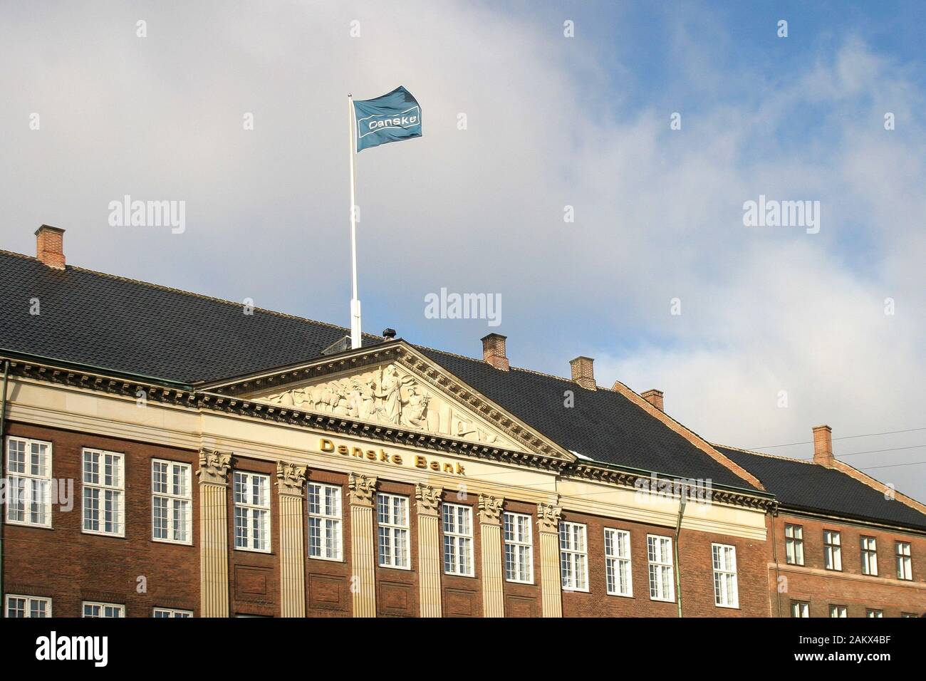 A Danske bank flag flying over a branch of Danske Bank in ...