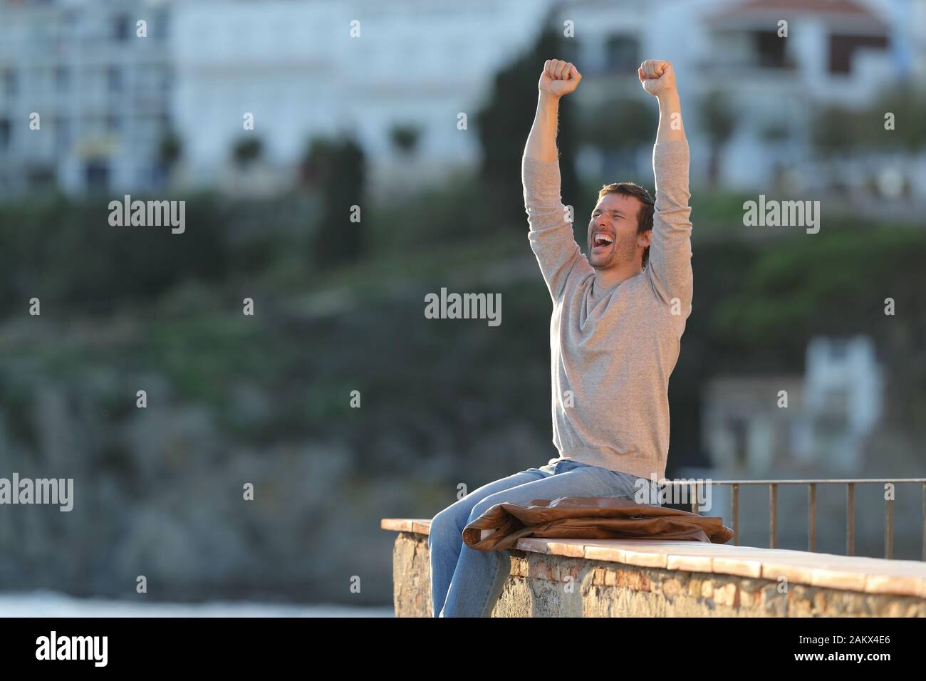 Man raising their arms in the air hi-res stock photography and images ...