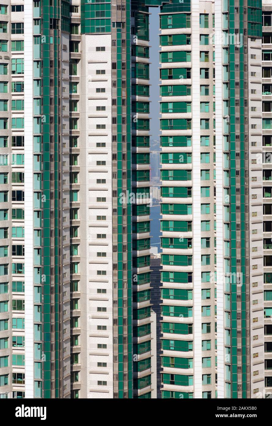 Hong Kong skyscrapers - close up view of green skyscraper with residential accommodation, Hong Kong Island, Hong Kong Asia Stock Photo