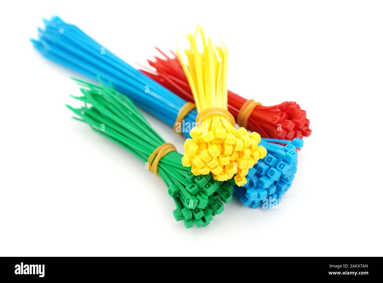 Different colors of plastic nylon cable ties closeup on white background Stock Photo