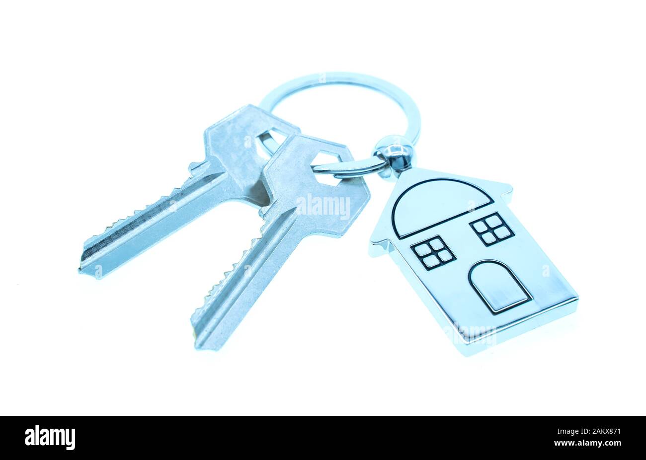 key chain with house symbol and keys on white background,Real estate concept Stock Photo