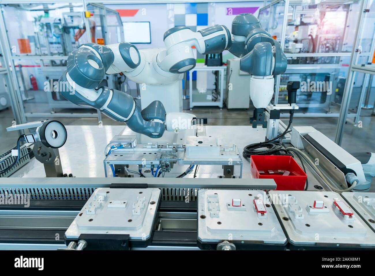 robotic arm catch for electronic assembly line. The robot for smart technology manufacturing process. Stock Photo