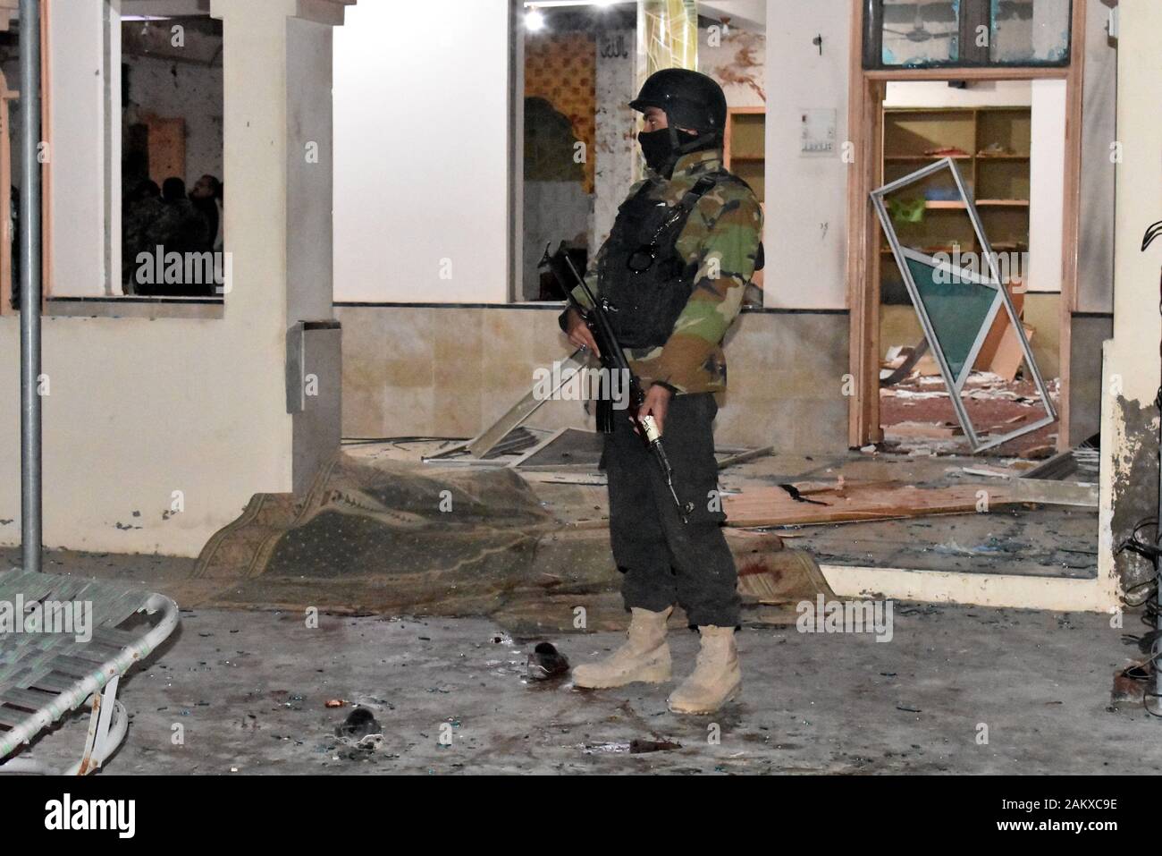 Quetta, Pakistan. 10th Jan 2020. A security member stands guard at the blast site in Quetta, Balochistan province, Pakistan, on Jan. 10, 2020. A blast hit a mosque in Quetta on Friday night, killing at least 14 people and injuring 20 others, a senior police officer said. (Photo by Asad/Xinhua) Credit: Xinhua/Alamy Live News Stock Photo