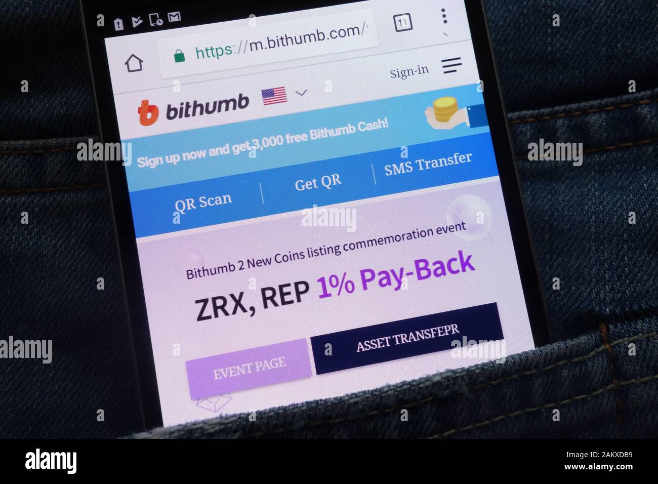 Bithumb cryptocurrency exchange website displayed on smartphone hidden in jeans pocket Stock Photo
